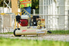 Ingersoll Rand SS3J5.5GH-WB 5.5 HP Honda gas-powered wheelbarrow air compressor at an outdoor construction site